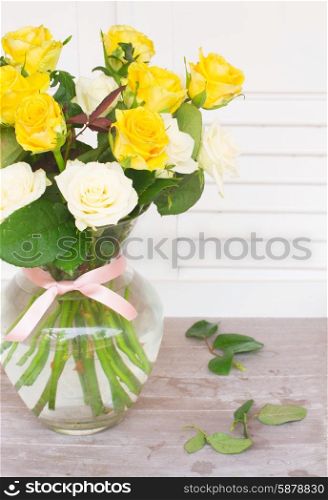bouquet of fresh roses. bunch of yellow and white fresh roses in vase