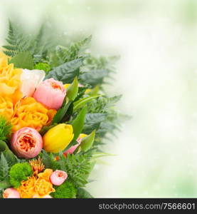 bouquet of fresh spring rose and tulip flowers on green bokeh background. bouquet of fresh spring flowers