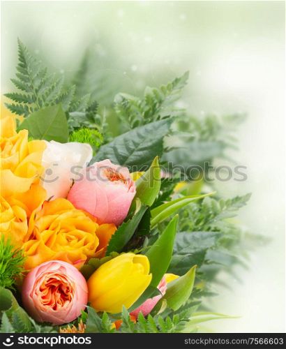 bouquet of fresh spring rose and tulip flowers on green bokeh background. bouquet of fresh spring flowers