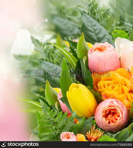 bouquet of fresh spring rose and tulip flowers on pink bokeh background. bouquet of fresh spring flowers