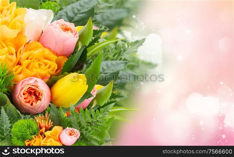 bouquet of fresh spring rose and tulip flowers on pink bokeh background. bouquet of fresh spring flowers
