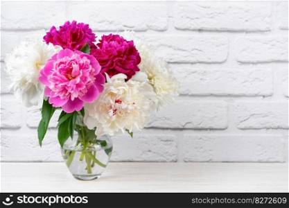 Bouquet of pink and white peony flowers in vase on white brick wall background. Mockup, template for holiday, birthday, mother’s day. Banner, header with copy space