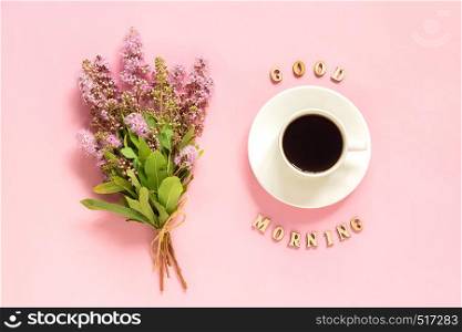 Bouquet of pink flowers, cup of coffee and text Good morning on pink background Greeting card Flat Lay Concept.. Bouquet of pink flowers, cup of coffee and text Good morning on pink background Greeting card Flat Lay Concept