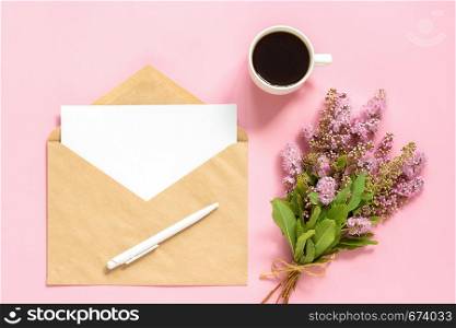 Bouquet of pink flowers, envelope with white blank card for text and cup of coffee on pink background Greeting card Flat Lay Mock up Concept Good morning or Womens day.. Bouquet of pink flowers, envelope with white blank card for text and cup of coffee on pink background Greeting card Flat Lay Mock up Concept Good morning or Women's day