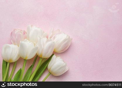 Bouquet of pink tulips on pink background. Mothers day, Valentines Day, Birthday celebration concept. Greeting card. Copy space for text, top view