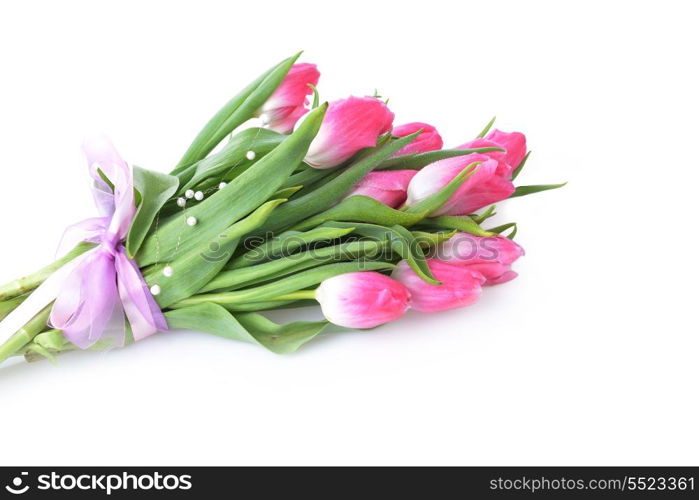 bouquet of pink tulips tied with ribbon