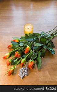 Bouquet of roses, candle And a necklace