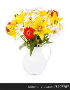 bouquet of various flowers in a jar on white background