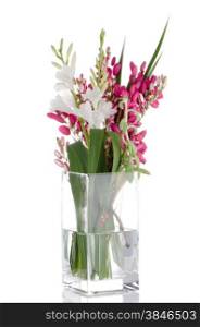 Bouquet of various flowers in glass jar on white background.