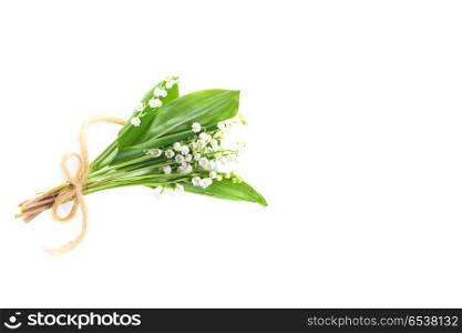 Bouquet of white flowers lilies of the valley with ribbon isolated on white background. Lilies of the valley
