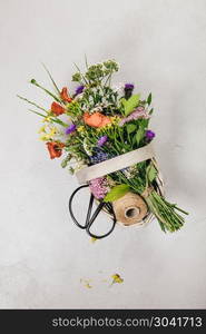 Bouquet of wild flowers in a basket. Flat lay, top view. Bouquet of wild flowers in a basket