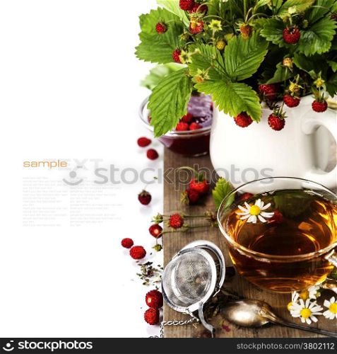 bouquet of wild strawberry with herbal tea and jam - bio food or health concept
