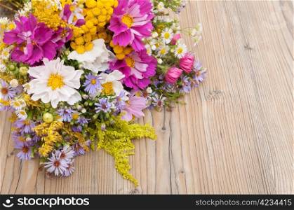 Bouquet of Wild Summer Flowers on Wooden Table