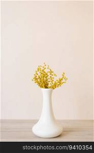 Bouquet of yellow mimosa flowers in a vase. Concept of women’s or mother’s day