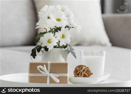 bouquet white flowers vase with wrapped gift