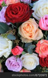 Bouquet with mixed roses in bright colors lile red and pink