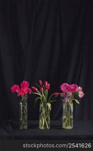 bouquets pink flowers vases with water