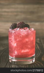 Bourbon Renewal cocktail garnished with blackberries