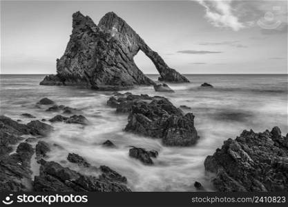 Bow Fiddle Rock - a natural sea arch near Portknockie on the northeast coast of Scotland. It is composed of Quartzite, a metamorphic rock which was originally quartz sandstone. This rock is part of the Cullen Quartzite formation which is seen along the coast between Buckie and Cullen. The formation is some 2,400m thick and dates from the Neoproterozoic Era, 1,000 to 541 million years ago.