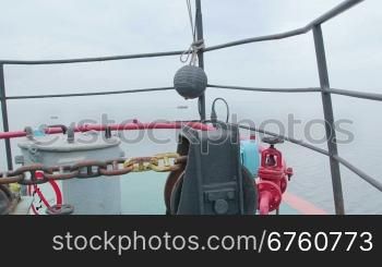 Bow of commercial fishing boat in the misty sea