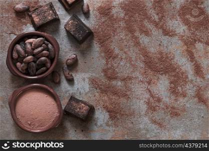 bowl cocoa powder beans with chocolate pieces