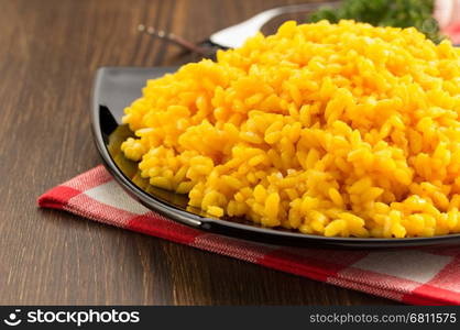 bowl full of rice on wooden background