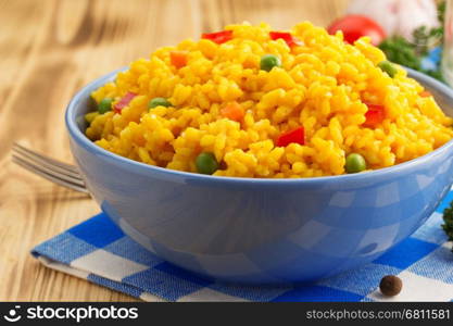 bowl full of rice on wooden background