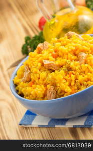 bowl full of rice on wooden background