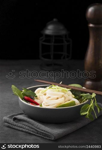 bowl noodles with chopsticks copy space