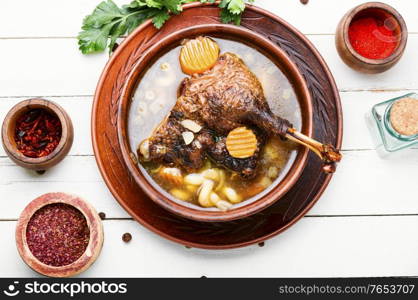 Bowl of appetizing healthy goose or duck soup.Chicken soup. Diet goose soup