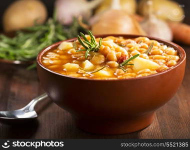 bowl of bean soup with rosemary