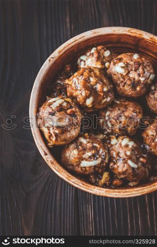 Bowl of beef and pork meatballs with grated cheese