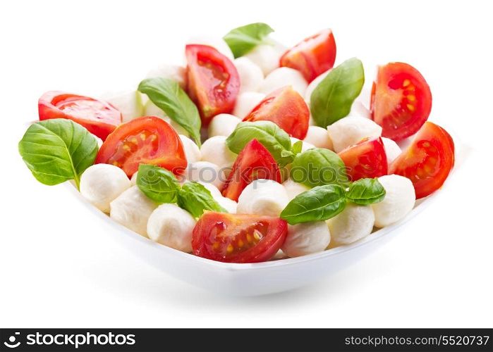 bowl of caprese salad on white background