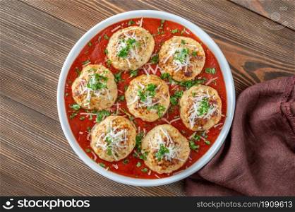 Bowl of chicken meatballs with tomato sauce