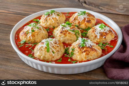 Bowl of chicken meatballs with tomato sauce