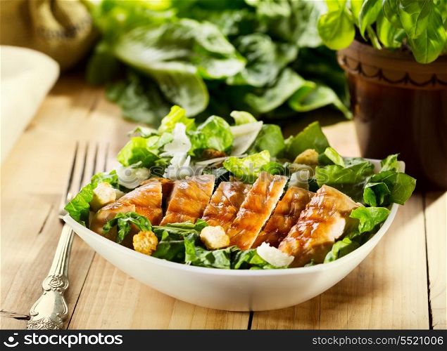 bowl of chicken salad on wooden table