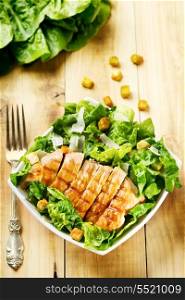 bowl of chicken salad on wooden table