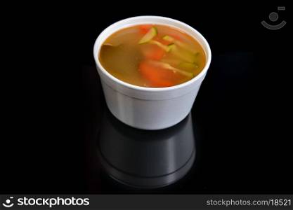 Bowl of chicken soup with vegetables