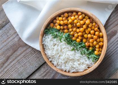 Bowl of chickpea curry with white rice and fresh cilantro