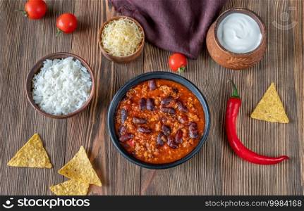 Bowl of chili con carne with ingredients