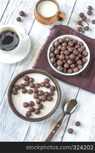 Bowl of chocolate corn balls with milk