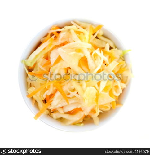 Bowl of coleslaw on white background from above