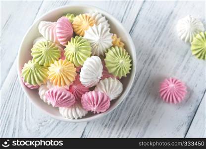 Bowl of colored meringues