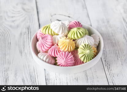 Bowl of colored meringues