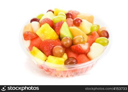Bowl of colorful, delicious fruit salad isolated on white.