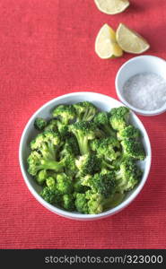 Bowl of cooked broccoli with seasonings