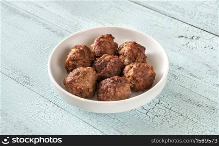 Bowl of cooked meat balls close up