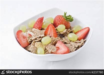 Bowl of corn flakes and fresh fruits