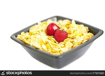 bowl of cornflakes cherry and strawberry isolated on white