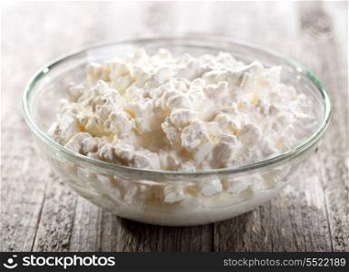 bowl of cottage cheese on wooden table